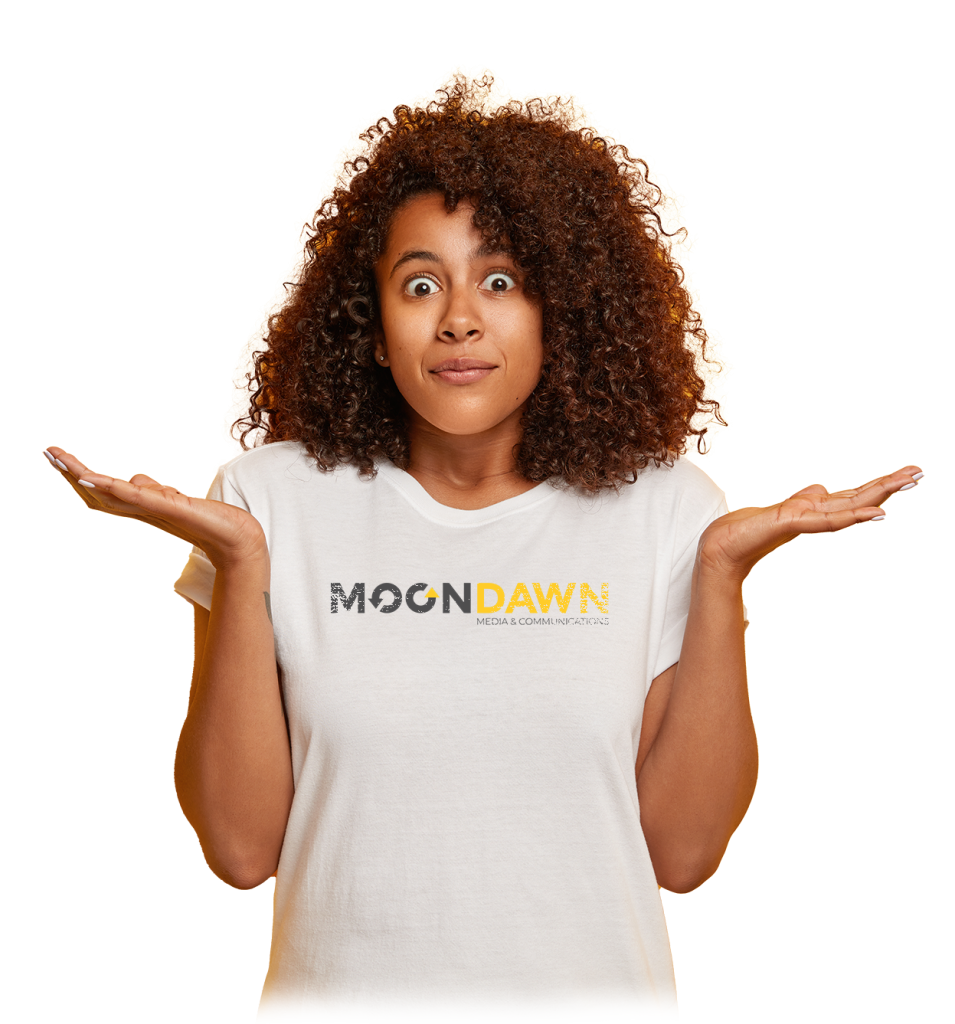 unsure puzzled female student spreads palms sideways stares with bugged eyes being clueless unaware has dark curly hair wears white t shirt poses against yellow wall free space upwards